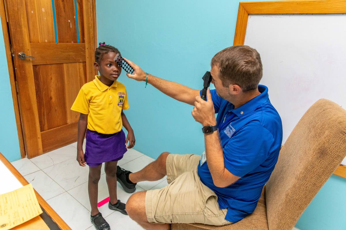 A student of Savanna-la-Mar Inclusive Academy undergoes a vision examination during the vision clinic hosted by the Issa Trust Foundation and Lions of Michigan at the Westmoreland-based school.