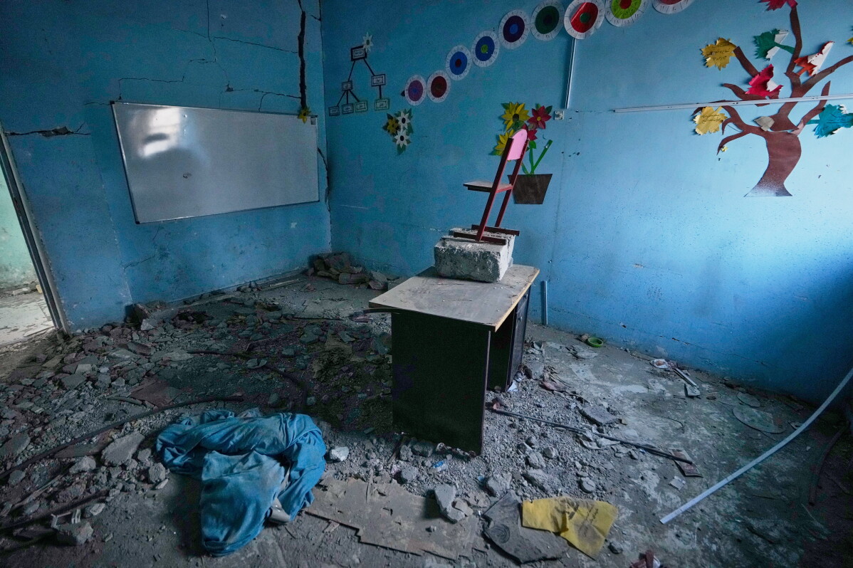 Colorful tree and flower decorations remain on the walls of a rubble-strewn classroom at Shajareh Tayyebeh school, damaged in a U.S. airstrike on Feb. 28, in Minab, southern Iran, Monday, Sept. 7, 2026. (AP Photo/Vahid Salemi)