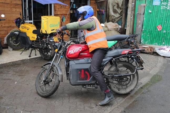 A rider sits on an electric Spiro motorcycle in Nairobi, Kenya, on February 24, 2026.