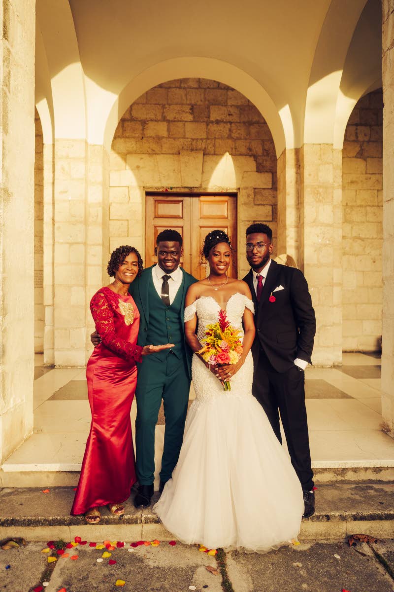 Damoy and Deneal (centre) are joined by Deneal’s mother, Debra Morris-Gordon, and brother, Devonte Gordon.