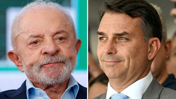 Brazilian presidential candidates President Luiz Inacio Lula da Silva (L) and senator Flavio Bolsonaro